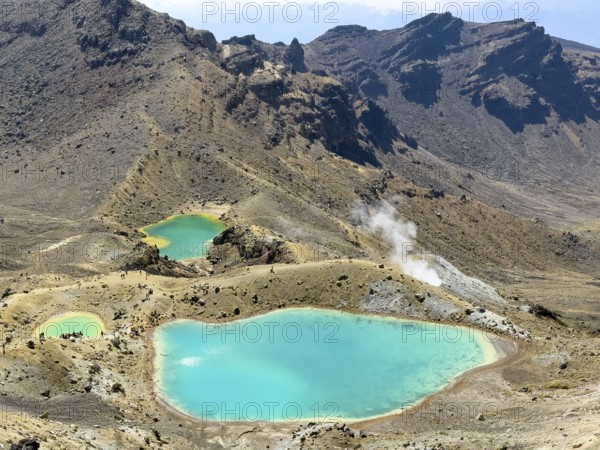 On the hiking trail of the Tongariro Alpine Crossing in Tongariro National Park with a view of the Emerald Lakes, North Island, New Zealand, Oceania