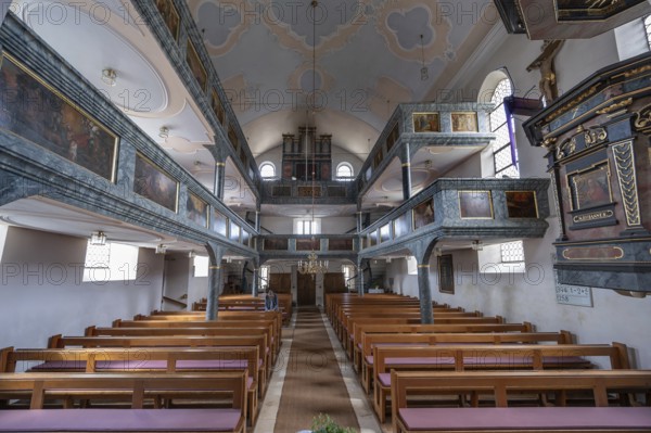 Interior with organ gallery and surrounding double galleries, historic Evangelical Lutheran fortified church of St Nicholas, Offenhausen, Middle Franconia, Bavaria, Germany