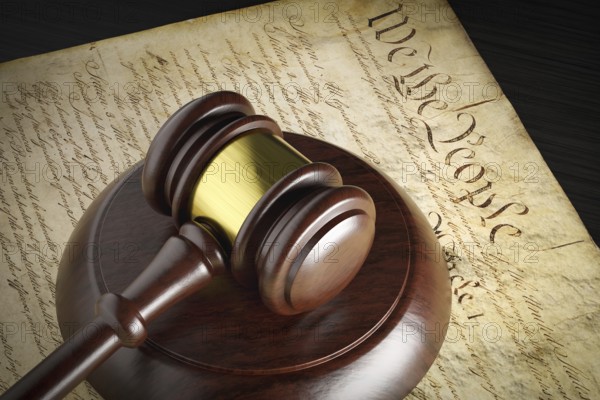 United states constitution and gavel resting on table