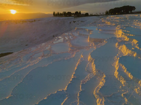 Twilight with illuminated terraces and reflecting water, surrounded by natural beauty, aerial view, sinter terraces, limestone sinter terraces, travertine terraces, Pamukkale, Denizli, UNESCO World Heritage Site, Anatolia, Turkey