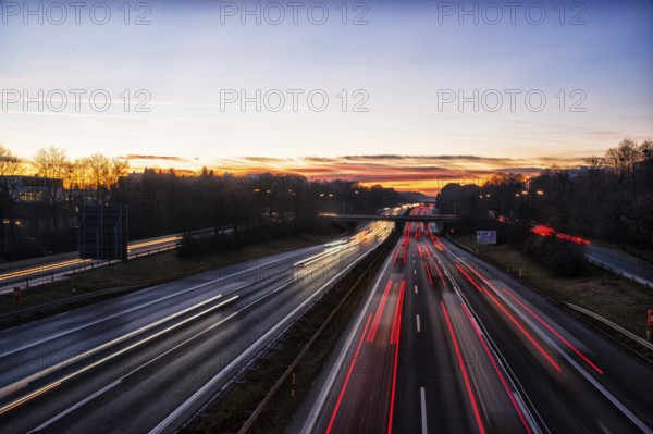 Motorway A96 at dusk and night with coloured lanes of moving cars. Munich, Bavaria, Germany