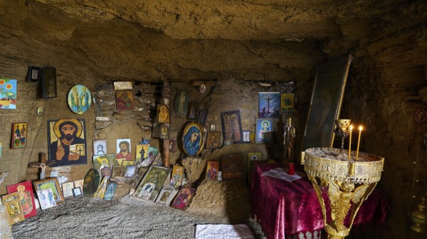 Religious sanctuary in a cave with orthodox icons and burning candles on an altar, chapel, Agios Nikolaos, rock chapel, Oasis Beach, east coast of Rhodes, Rhodes, Dodecanese, Greek Islands, Greece