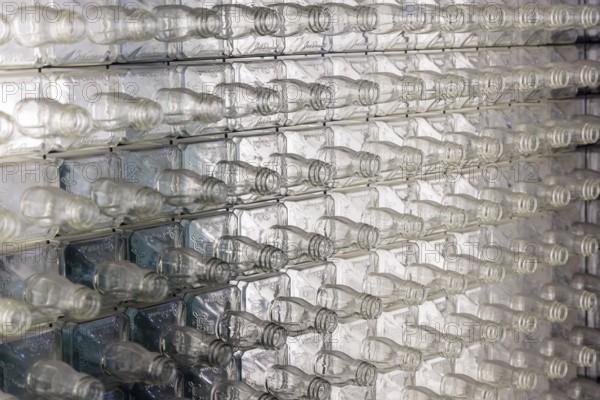 Wall of empty glass whiskey bottles at the Visitor Center of the Jack Daniel Distillery in Lynchburg, Tennessee