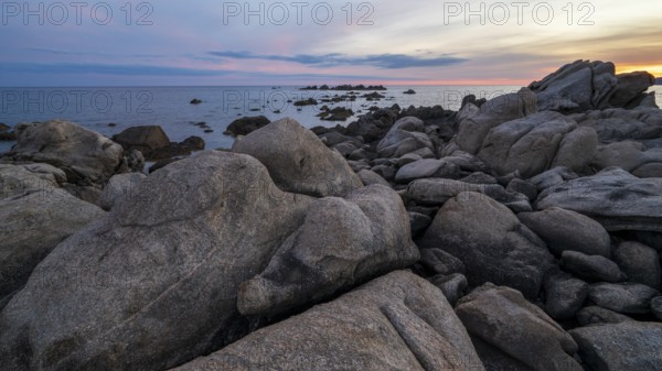 Sunset, rocky coast near Porto Pollo, Corsica, France