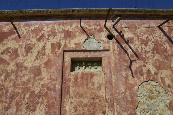 Lost Place, Old electrical installation in a weathered red brick wall with cables, Radio Station, WW2, Agios Nikolaos Radio, Agia Marina, Leros, Dodecanese, Greek Islands, Greece