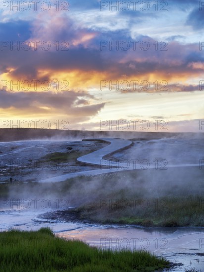 Curved wooden path, sulphur vapour, Hveravellir geothermal area, sunset, Icelandic highlands, Suðurland, Sudurland, Iceland