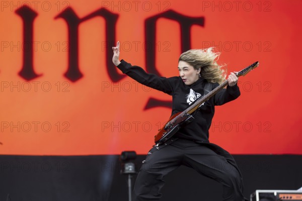Daniela Villarreal Vélez, singer of The Warning is surprised by a gust of wind at the Rock am Ring Festival on Sunday, Nürburgring race track race track, 08.06.2025