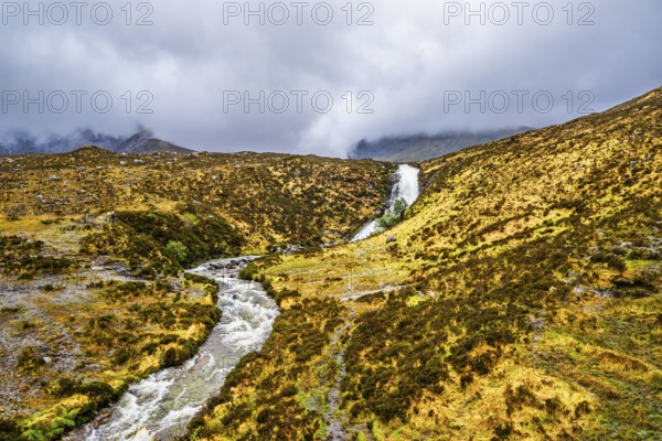 Eas a' Bhradain waterfall, Red Cuillin mountains, Loch Ainort, Isle of Skye, Scotland, UK
