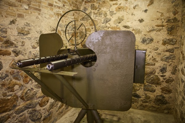 A historical gun mounted on a stone wall, War Museum, Military Museum, Tunnel Museum, Lakki, Leros, WW2, Dodecanese, Greek Islands, Greece