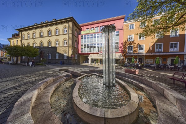 Angererbrunnen, crystal fountain, fountain, pedestrian zone, commercial buildings, buildings, trees, blue sky, cloudless, Poststrasse, Bad Reichenhall, Berchtesgadener Land district, Bavaria, Germany