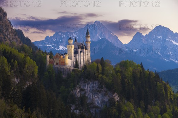 Majestic Neuschwanstein Castle in front of an impressive Alpine panorama, Schwangau near Füssen, Ostallgäu district, Swabia, Bavaria, Germany