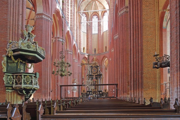Interior view of the Gothic St. Nikolai Church with pulpit and pulpit bonnet, UNESCO, Brick Gothic, Brick church, Pulpit bonnet, Pulpit lid, Soundboard, Pulpit canopy, Pews, Wismar, Mecklenburg-Western Pomerania, Germany