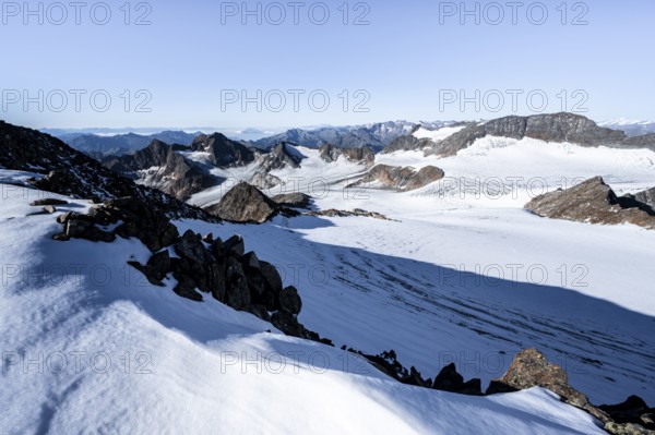 Snow on the Wilder Freiger mountain peak, picturesque high mountain landscape, view of Übeltalferner glacier and rocky mountain peaks Königshofspitz and Sonklarspitze, Stubai Alps, South Tyrol, Italy