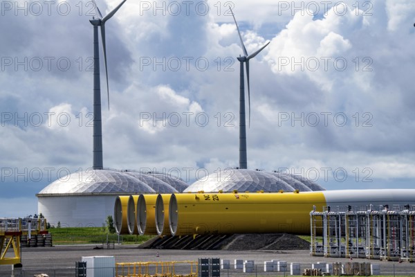 The seaport of Eemshaven, Julianahaven Basin, where the foundation structures, monopiles, for offshore wind farms are stored, which then support the actual wind turbines, the components are transported to the wind farms in the North Sea on large workboats and anchored to the seabed, where the wind turbines are then built, Eemshaven, Netherlands