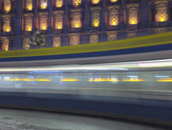 Tram at Night in Bahnhofstrasse and Illuminated Building in Long Exposure in a Winter Night in City of Zurich, Switzerland