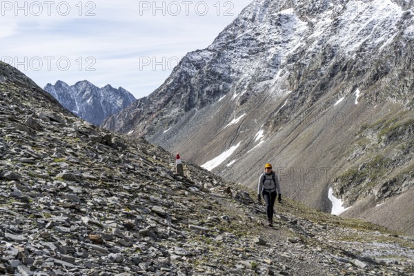 Mountaineer on a rocky hiking trail, ascent to the summit of Böses Weibl, Wiener Höhenweg, Schober Group, Hohe Tauern National Park, Carinthia, Austria