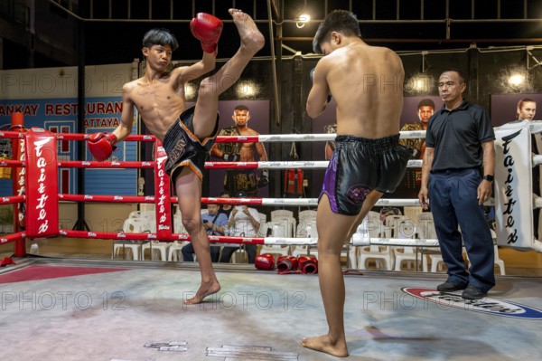 Thai boxing Muai Thai boxer in action, Pattaya, Thailand