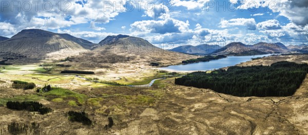 Panorama of Mountains and Moors over Loch Tulla and River Orchy from a drone, Highlands, Scotland, UK