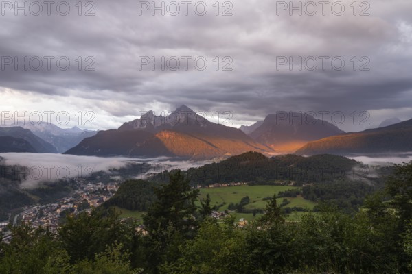 Marxenhöhe near Berchtesgaden at sunrise with a view of the Watzmann in the morning mist after the rain