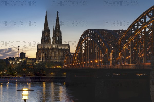 Cologne Cathedral and the Hohenzollern Bridge illuminated with LED lights, Cologne, North Rhine-Westphalia, Germany