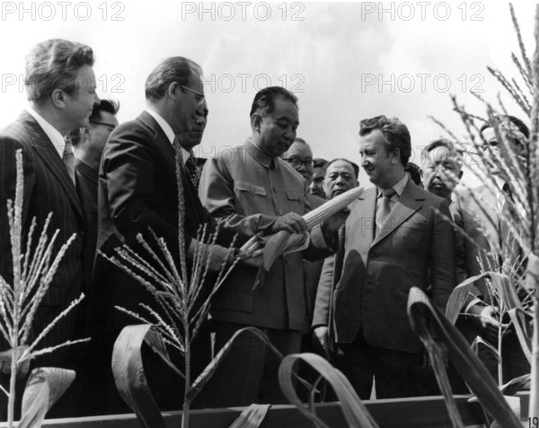 Huo Guo Feng, successor to Mao Zedong, Chairman of the Central Committee of the Communist Party of China, with Eastern European delegation in China, agricultural industry, corn on the corn cob, ca. 1980s