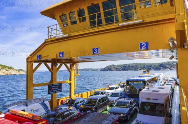 Cars and lorries on a car ferry operating as a floating road, near Lysekil, Bohuslän, Västra Götalands län, Sweden, Scandinavia, for editorial use only
