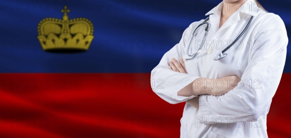 Doctor with crossed arms on Liechtenstein flag. Liechtenstein health and care concept. Female doctor on Liechtenstein flag