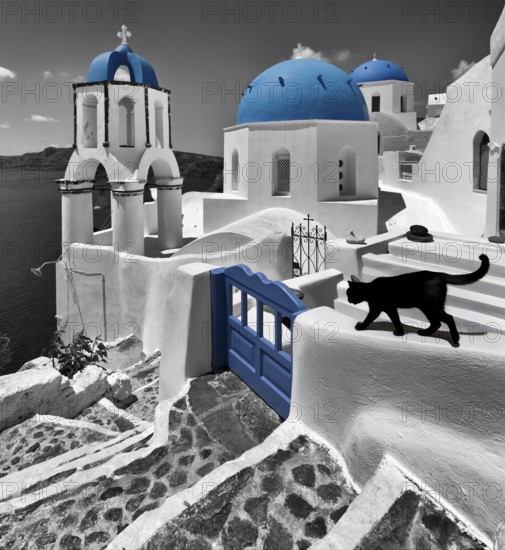 Black and white coloured churches on Oia Santorini Greece Cat built in