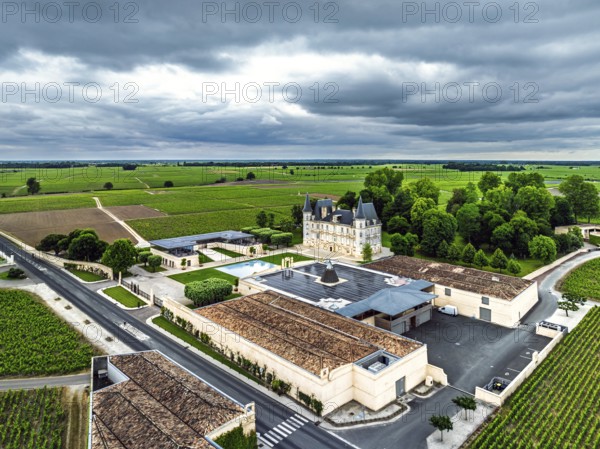 Chateau Pichon Longueville Baron Vineyard and grape fields around Pauillac from a drone, Bordeaux, Gironde, Nouvelle-Aquitaine, France
