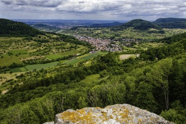 Wide view over the Neidlingen valley with a small village and surrounding hills, Neidlingen