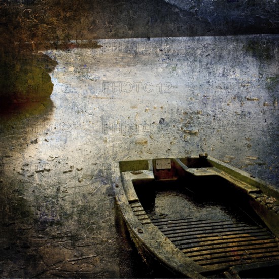 A weathered boat lies still on a serene water body at dusk, with reflections of light dancing on its surface and uneven shorelines adding to its rustic charm. Puy de Dome. Auvergne-Rhone-Alpes. France