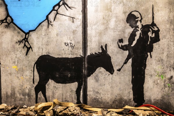 Banksy - The Separation Barrier and Bethlehem Murals, barrier between Israel and the occupied West Bank, 2005, Bethlehem, exhibition The World of Banksy