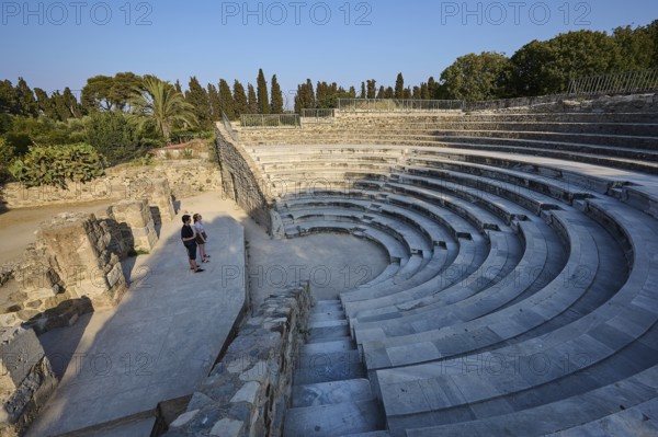 Ancient amphitheatre with stone steps and a few visitors, surrounded by nature, Ancient Theatre, Odeon, Kos Town, Kos, Dodecanese, Greek Islands, Greece