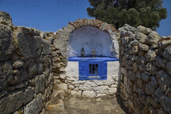 Ancient stone chapel in a peaceful, natural setting with clear blue skies, Artemis Temple, Artemis, Diana, goddess of the hunt, altar. Church, tower, near the airport in the north of the island, Leros, Dodecanese, Greek Islands, Greece