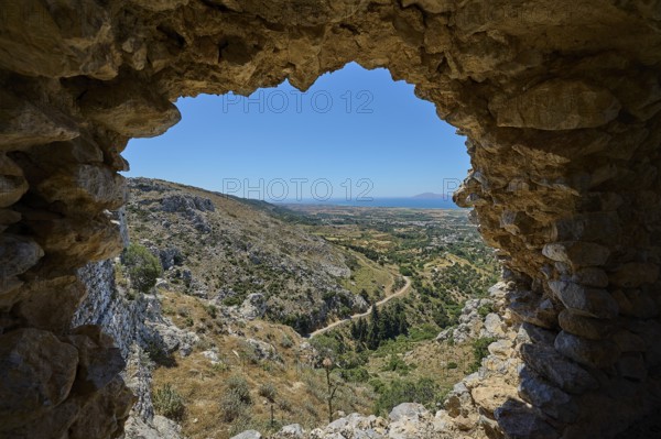 View from a ruined window onto a wide landscape, Abandoned Village, Lost Place, Pyli, Paleo Pyli, Byzantine Fortress, Kos, Dodecanese, Greek Islands, Greece