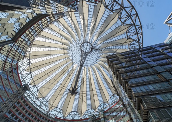 Low-angle view of the glass roof of Das Center at Potsdamer Platz, formerly known as the Sony Center, Berlin, Germany