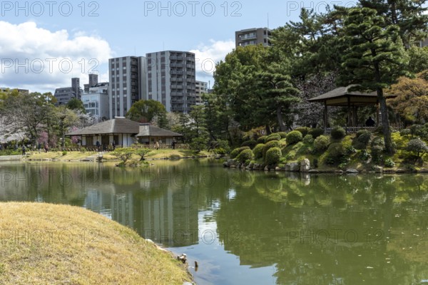 Shukkei-en with green plants and Takuei-chi pond in spring, historical Japanese strolling garden, Japanese garden, green area, tourist attraction, sight, Naka-ku, Hiroshima, Japan