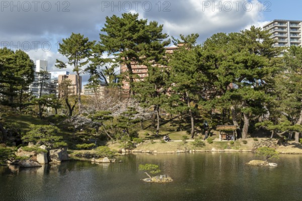 Shukkei-en with Sekisui-gan stone formation and Takuei-chi pond in spring, historical Japanese strolling garden, Japanese garden, green area, tourist attraction, sight, Naka-ku, Hiroshima, Japan