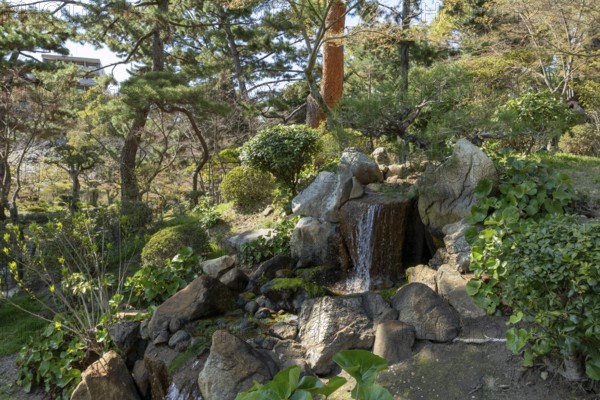 Shukkei-en with waterfall at Hakuryu-sen stream, historical Japanese strolling garden, Japanese garden, green area, tourist attraction, sight, Naka-ku, Hiroshima, Japan