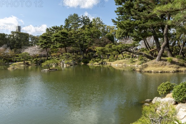 Shukkei-en with Sekisui-gan stone formation and Takuei-chi pond in spring, historical Japanese strolling garden, Japanese garden, green area, tourist attraction, sight, Naka-ku, Hiroshima, Japan