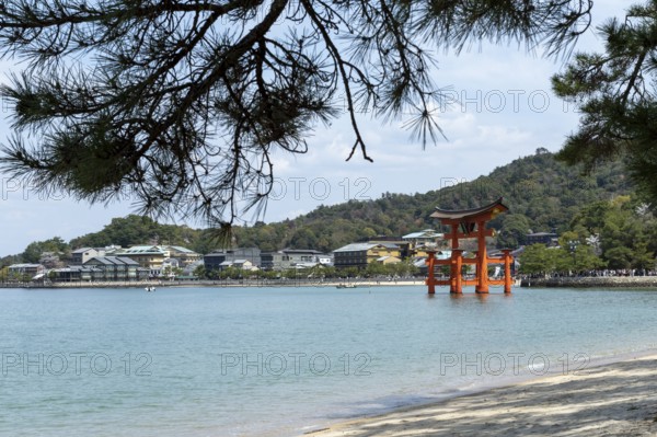 Beach with surf and torii in the water, sight, tourist attraction, UNESCO World Heritage Site, Itsukushima Shrine, Miyajima Island, Hatsukaichi, Hiroshima Prefecture, Japan