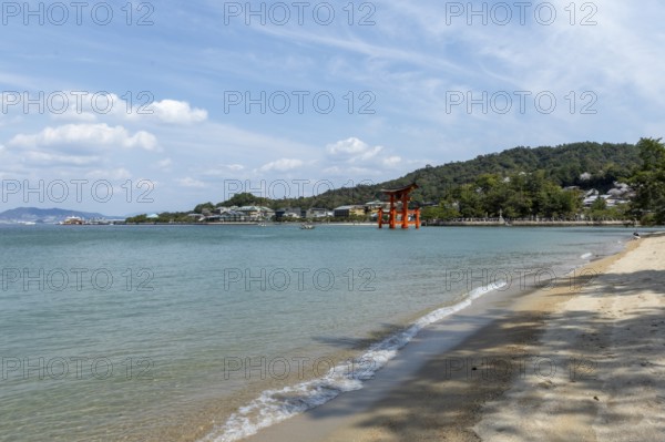 Beach with surf and torii in the water, sight, tourist attraction, UNESCO World Heritage Site, Itsukushima Shrine, Miyajima Island, Hatsukaichi, Hiroshima Prefecture, Japan