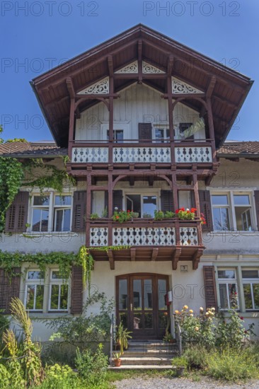 Old villa with wooden shingle façade, large balcony with floral decorations, around 1900, Dornbirn, Vorarlberg, Austria