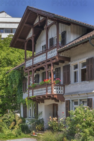 Old villa with wooden shingle façade, large balcony with floral decorations, around 1900, Dornbirn, Vorarlberg, Austria