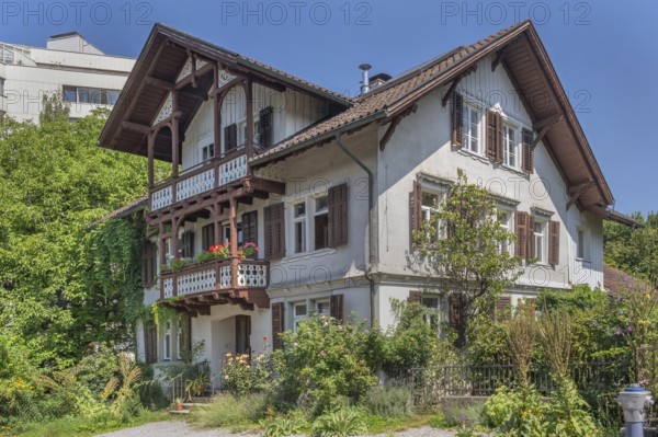 Old villa with wooden shingle façade, large balcony with floral decorations, around 1900, Dornbirn, Vorarlberg, Austria