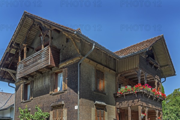 Old villa with wooden shingle façade, large balcony with floral decorations, around 1900, Dornbirn, Vorarlberg, Austria
