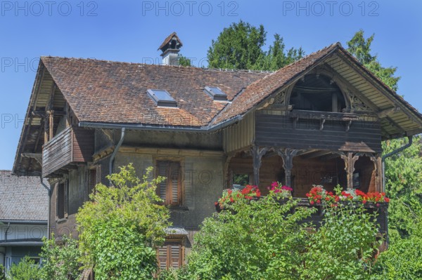 Old villa with wooden shingle façade, large balcony with floral decorations, around 1900, Dornbirn, Vorarlberg, Austria