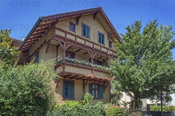Ochre yellow wooden barrel, Villa Auf der Flur with large balcony around 1900, Dornbirn, Vorarlberg, Austria