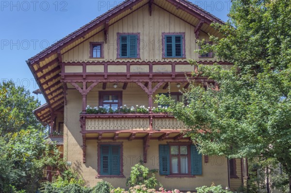 Ochre yellow wooden barrel, Villa Auf der Flur with large balcony around 1900, Dornbirn, Vorarlberg, Austria