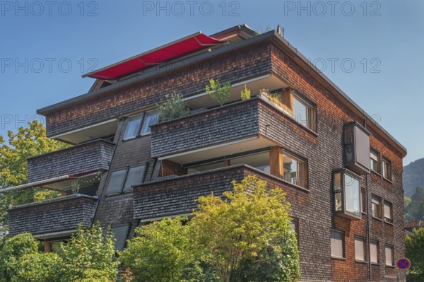 Modern house with wooden shingle façade, large green balcony, Dornbirn, Vorarlberg, Austria